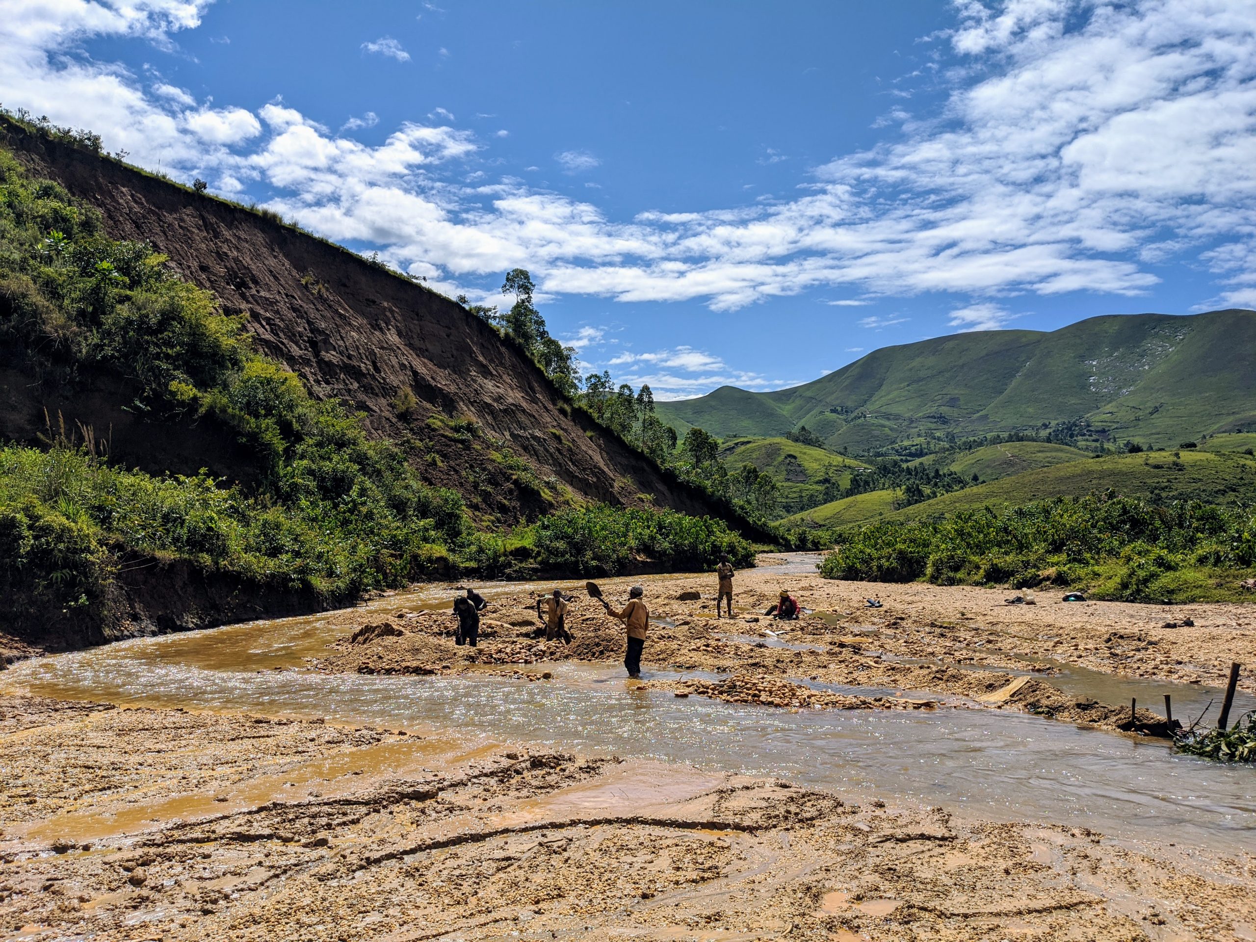 Four artisanal gold miners in the Democratic Republic of the Congo at a site visited by the Public-Private Alliance for Responsible Minerals Trade delegation in 2019. 