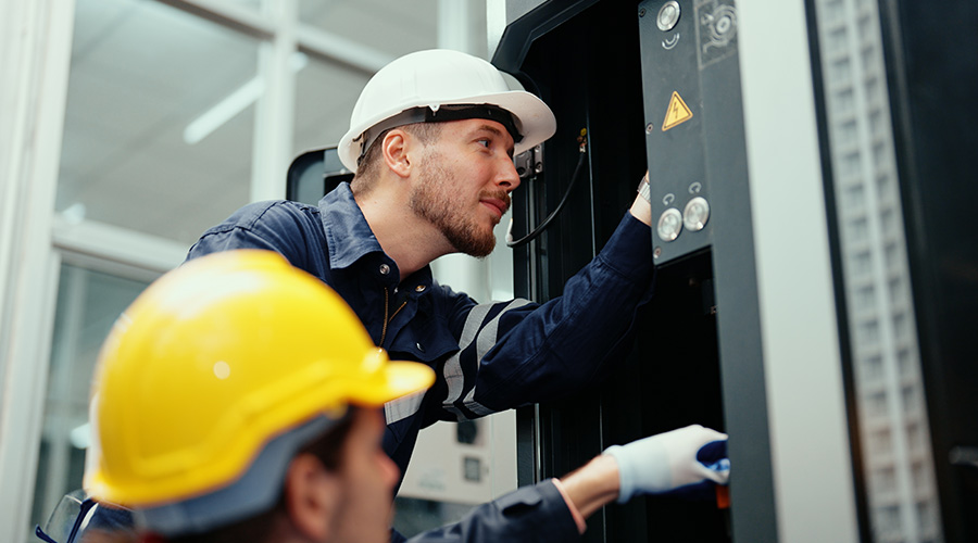 engineers working on electrical components 