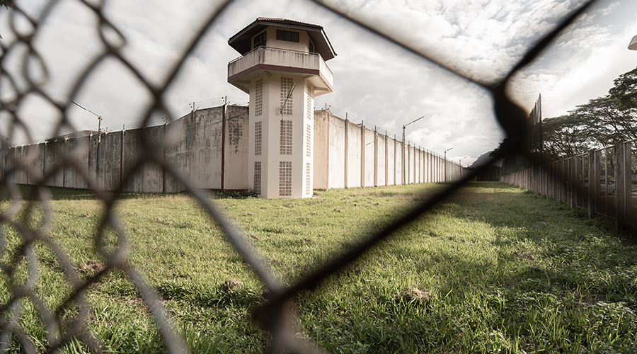 prison tower through fence 